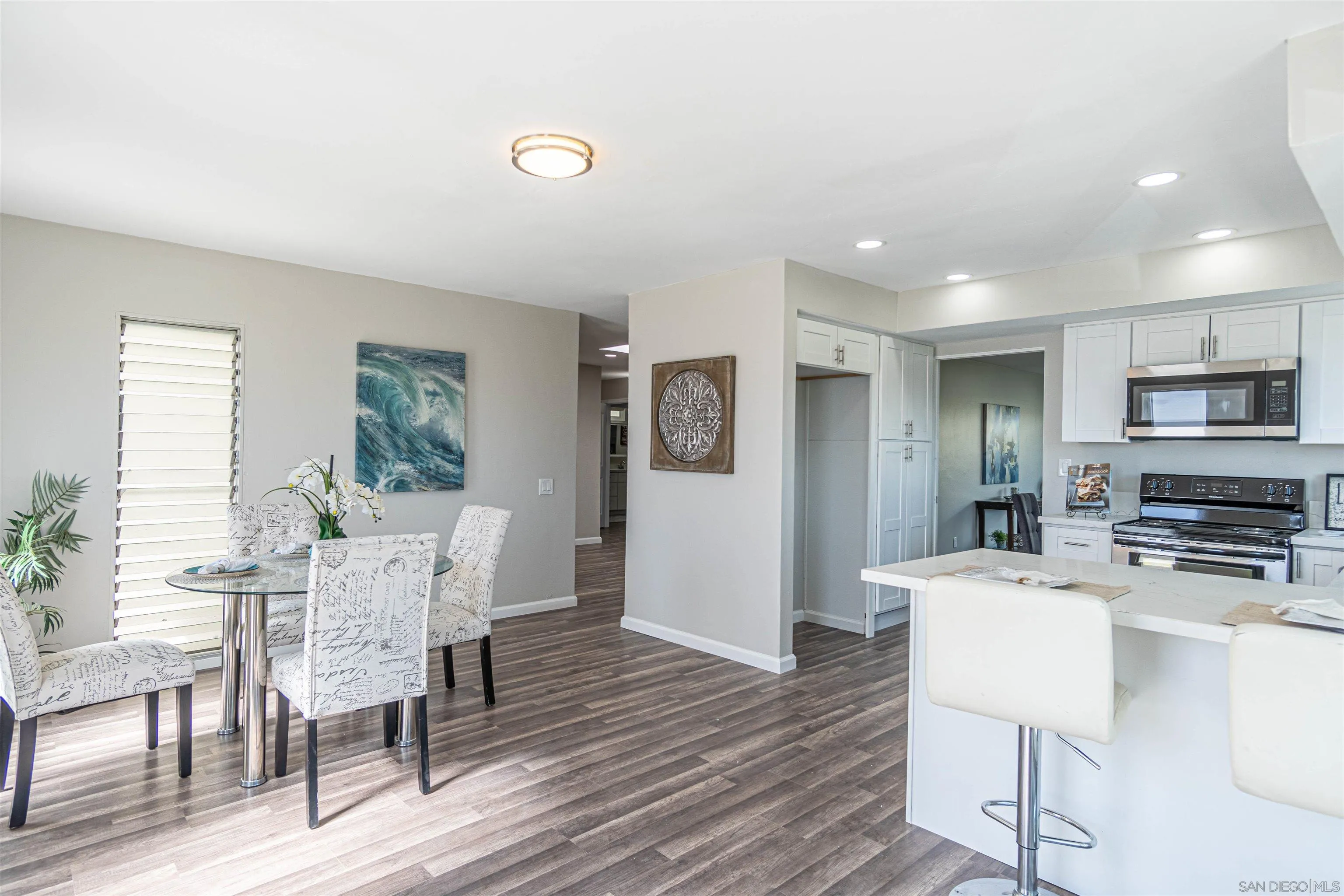 3747 Vista Campana South, Unit 43 Oceanside, CA 92057 - Photo 10 of 30 a view of a dining room with furniture window and wooden floor