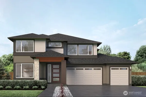 a front view of a house with garage