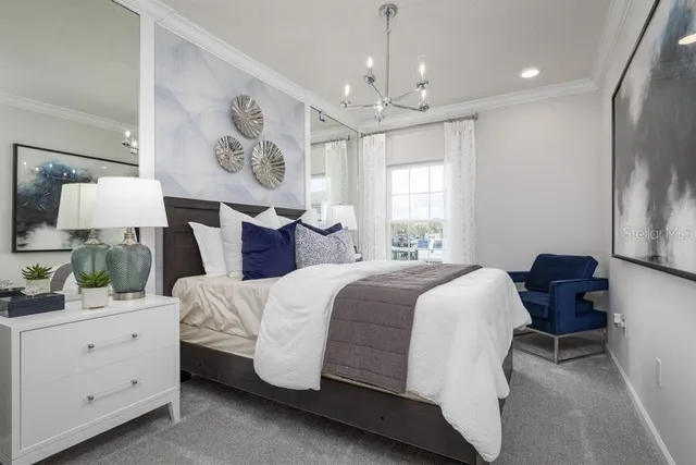 a spacious bedroom with a bed dresser and a window