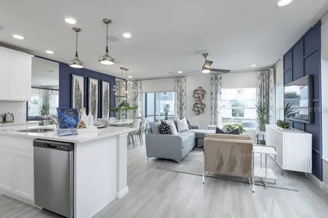 a open kitchen with stainless steel appliances granite countertop a stove and refrigerator