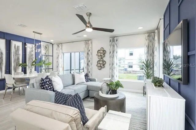 a living room with furniture and a large window