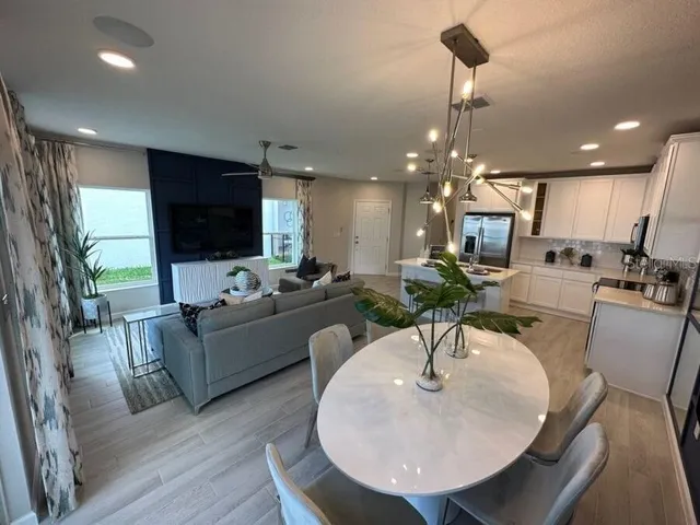 a living room with fireplace furniture and a flat screen tv