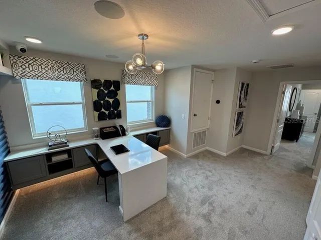 a kitchen that has a sink stainless steel appliances a counter space and a window