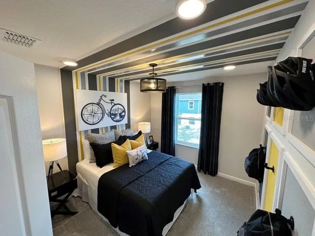 a bedroom with a bed and cabinets