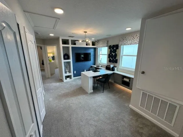 a view of livingroom with furniture and flat screen tv