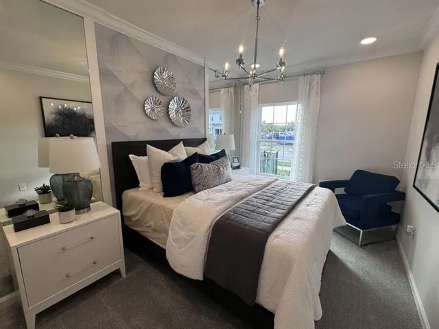 a bed room with a bed mirror and a window