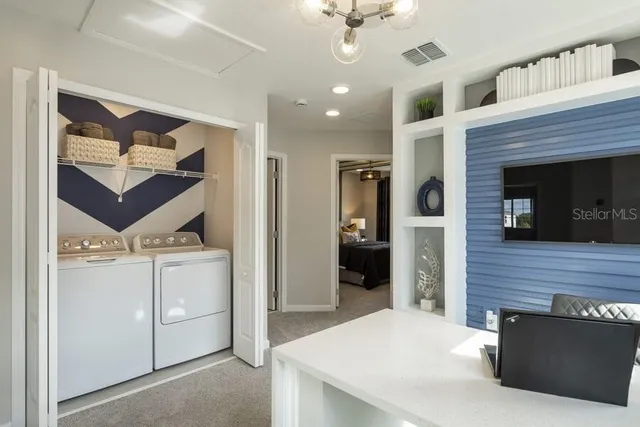 a kitchen with a refrigerator and a stove