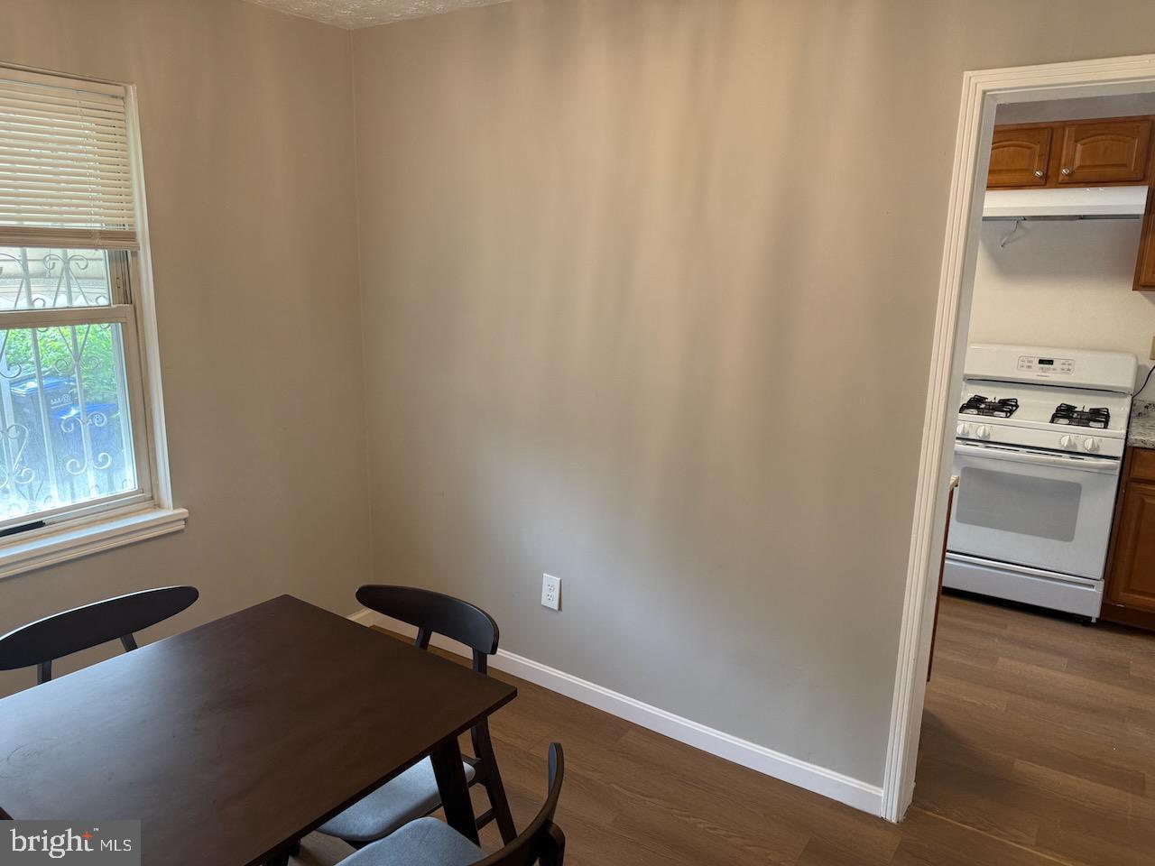 5032 Sargent Road Northeast Washington, DC 20017 - Photo 17 of 40 a room with a wooden floor and a window