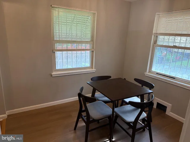 a view of a room that has a table and chair in it