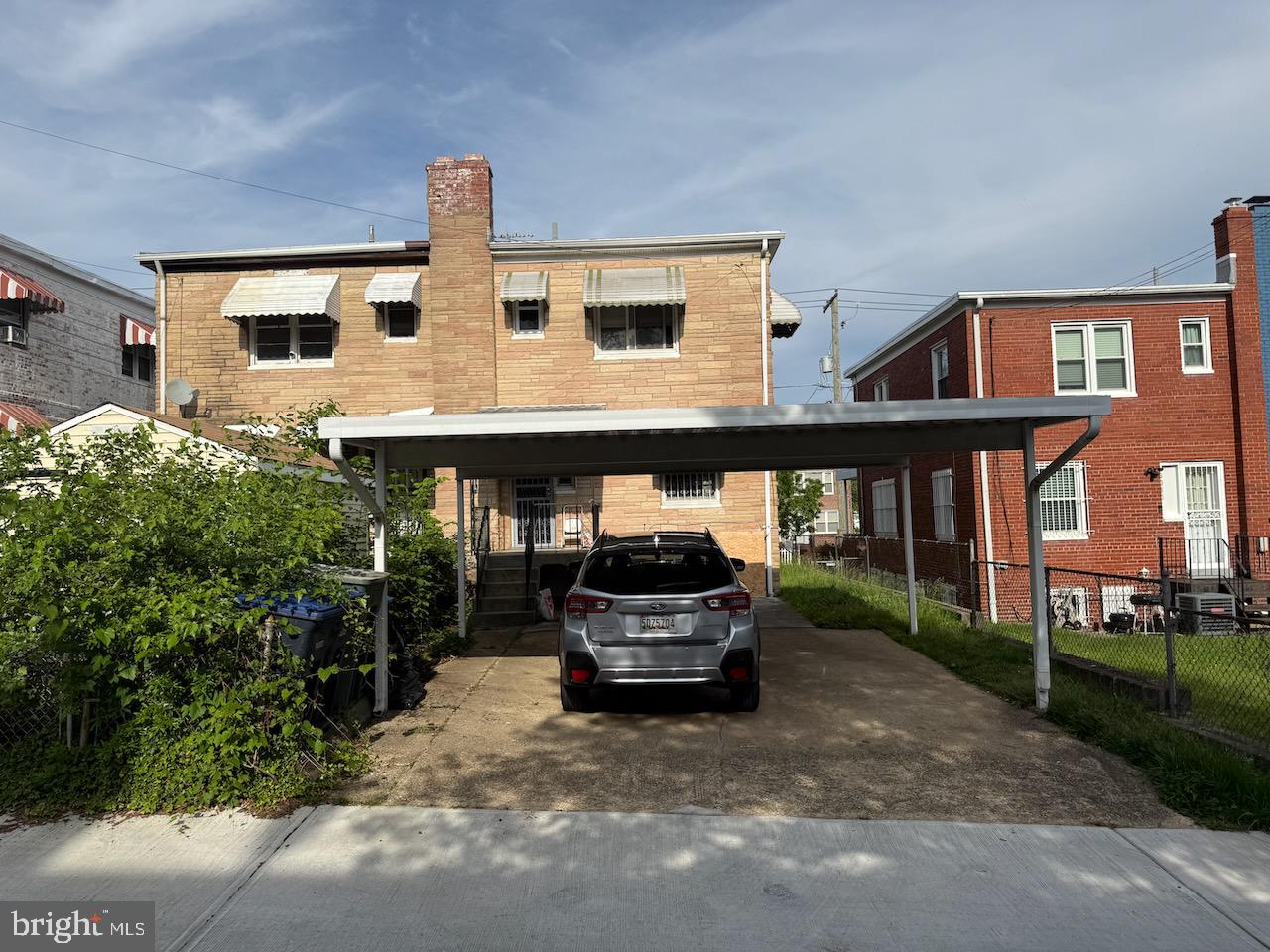 5032 Sargent Road Northeast Washington, DC 20017 - Photo 2 of 40 a front view of a house with parking area