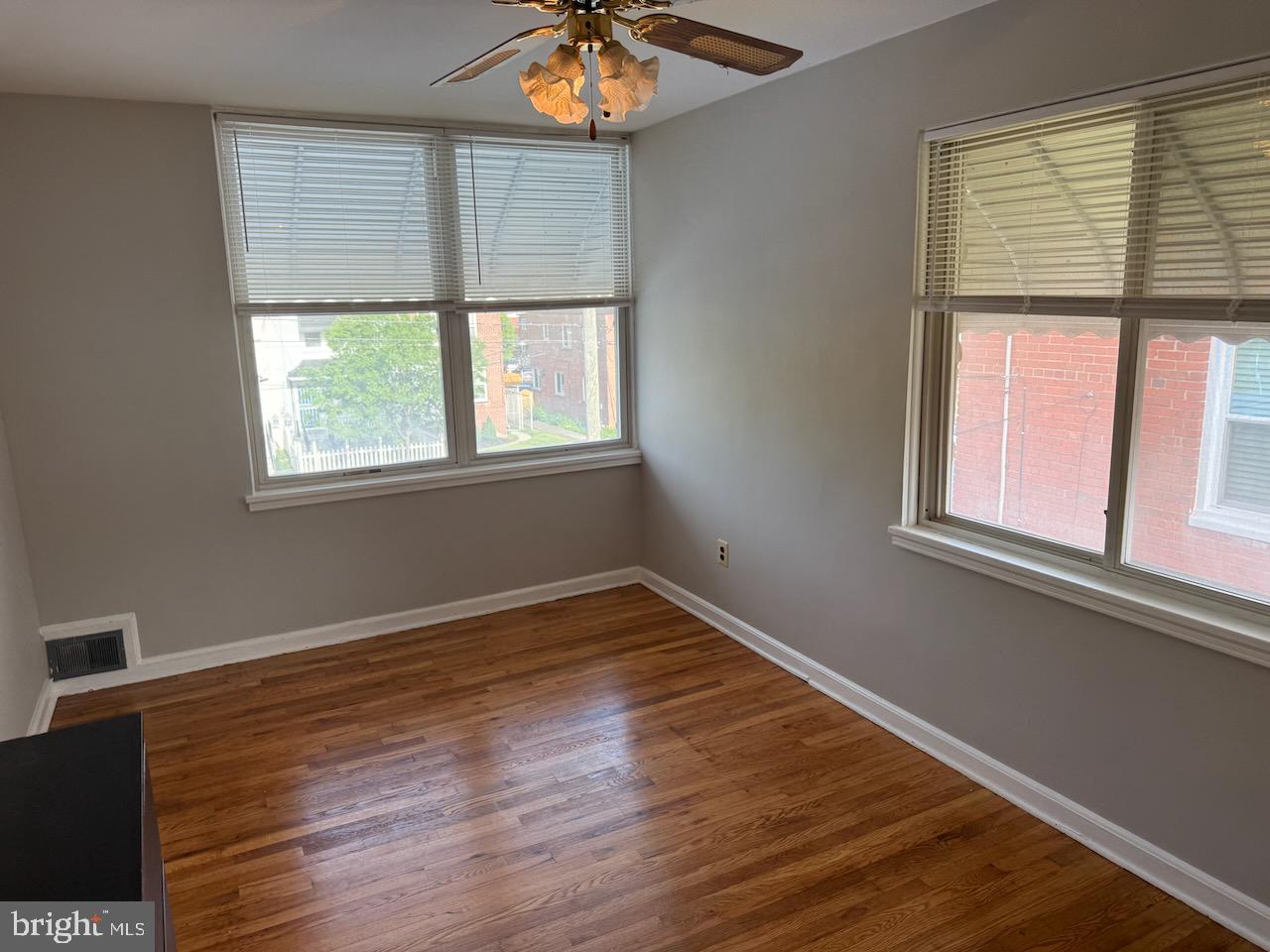 5032 Sargent Road Northeast Washington, DC 20017 - Photo 22 of 40 an empty room with wooden floor and windows