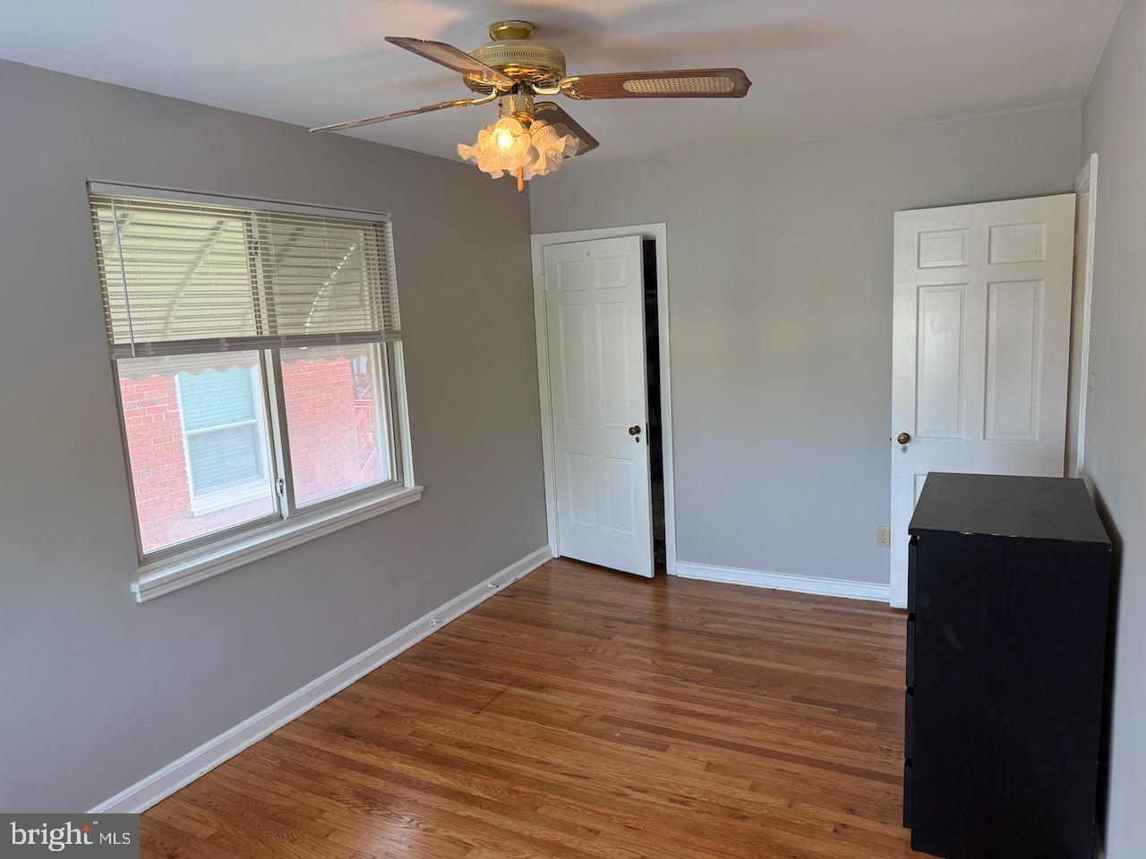5032 Sargent Road Northeast Washington, DC 20017 - Photo 23 of 40 a view of an empty room with wooden floor and a window