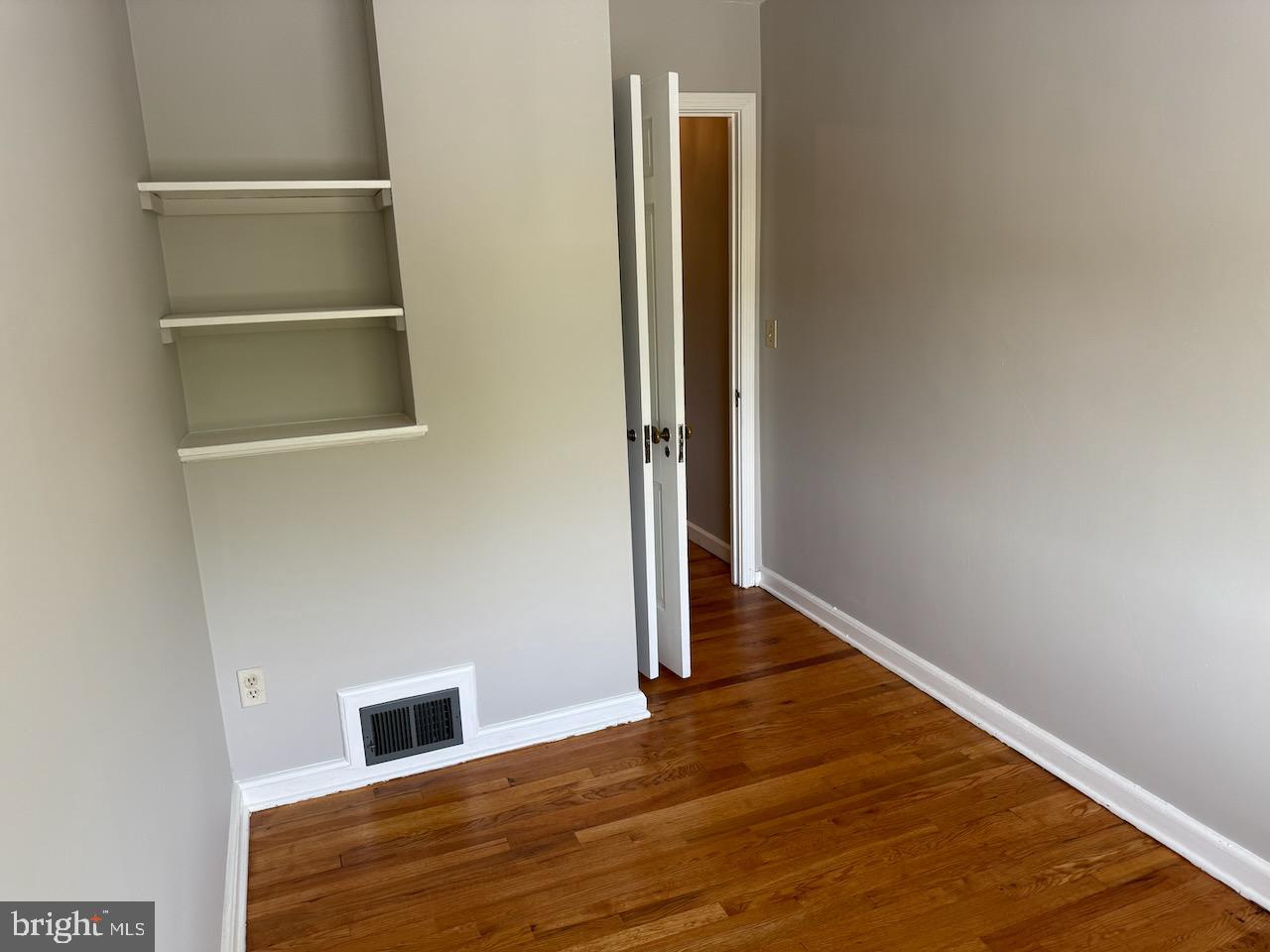 5032 Sargent Road Northeast Washington, DC 20017 - Photo 28 of 40 a view of an empty room with wooden floor