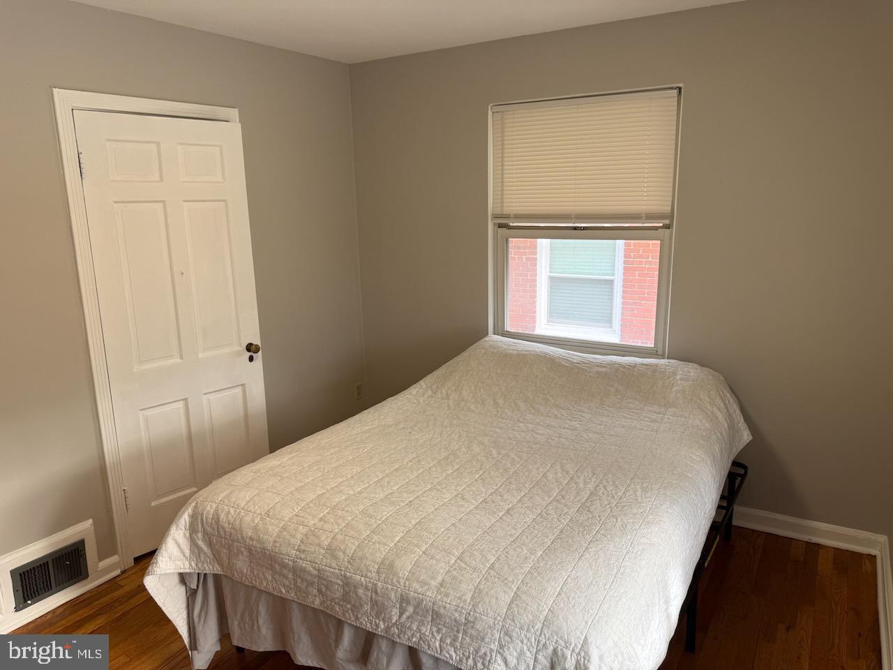 5032 Sargent Road Northeast Washington, DC 20017 - Photo 30 of 40 a bedroom with a bed and a window