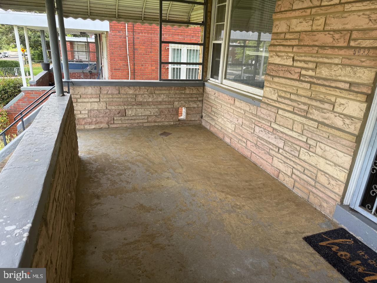 5032 Sargent Road Northeast Washington, DC 20017 - Photo 3 of 40 a view of balcony with a couple of cars parked in parking lot