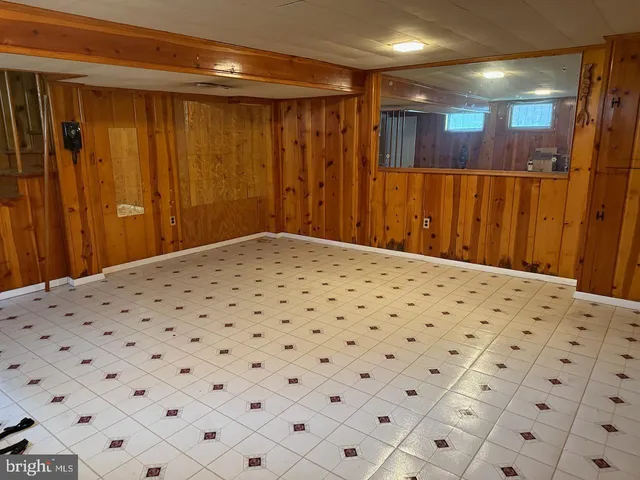 a bedroom with a bed and a mirror