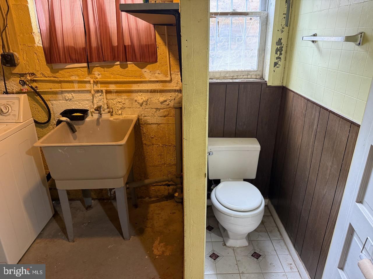 5032 Sargent Road Northeast Washington, DC 20017 - Photo 35 of 40 a bathroom with a toilet and a sink