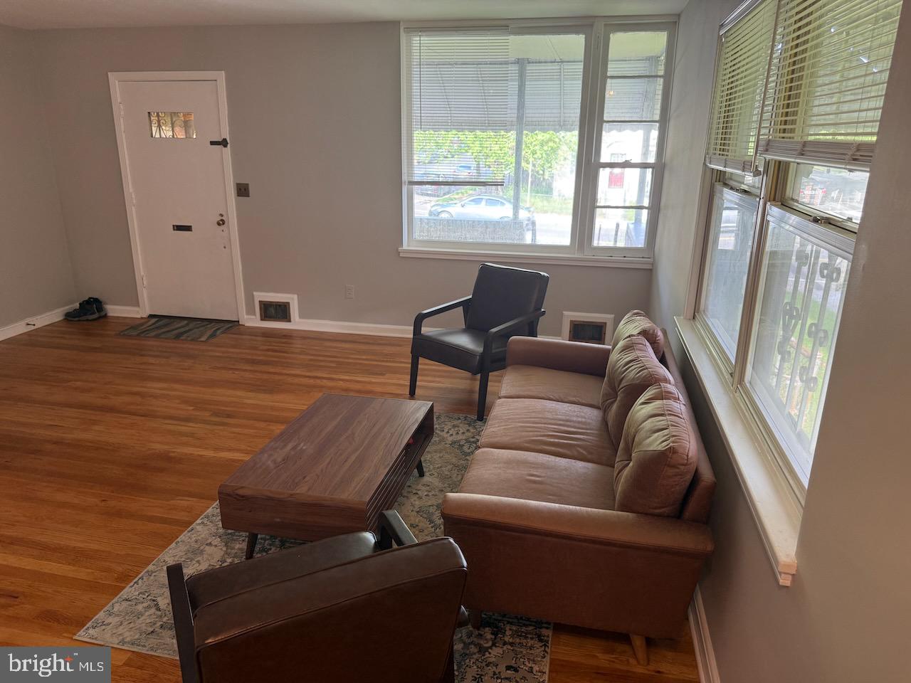 5032 Sargent Road Northeast Washington, DC 20017 - Photo 6 of 40 a living room with furniture and a floor to ceiling window