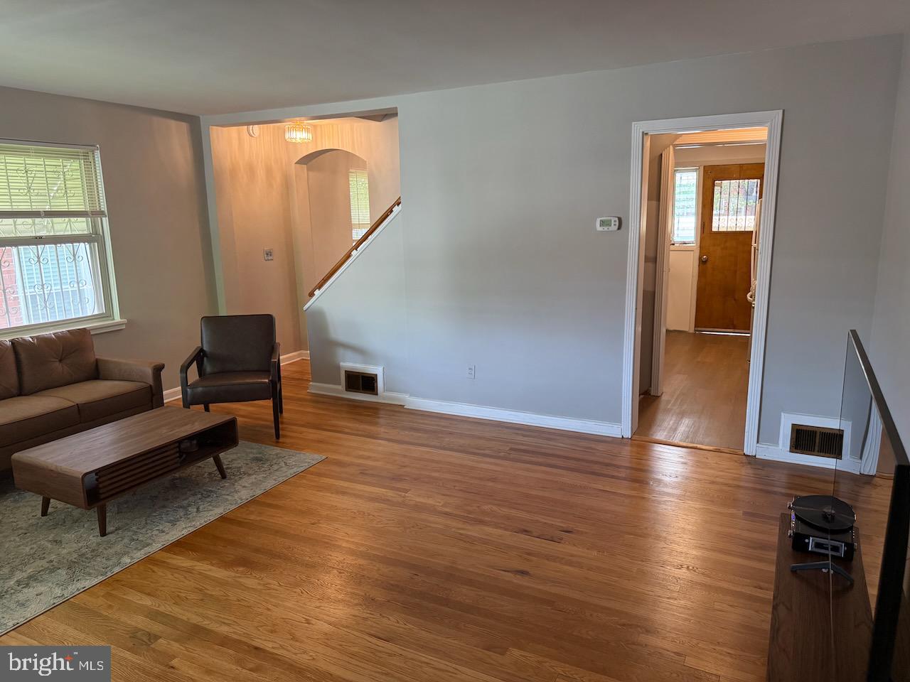 5032 Sargent Road Northeast Washington, DC 20017 - Photo 8 of 40 a living room with furniture and a potted plant