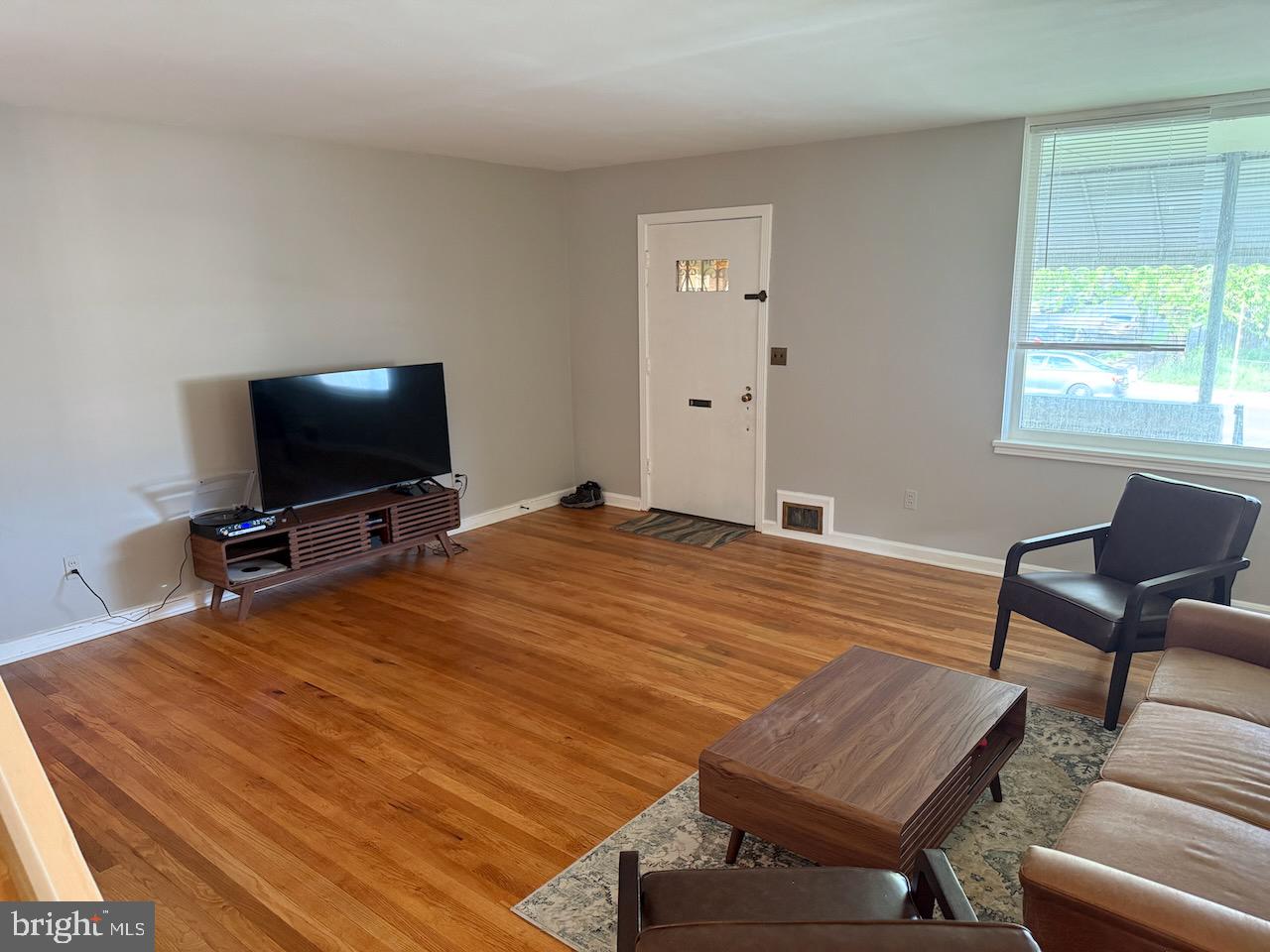 5032 Sargent Road Northeast Washington, DC 20017 - Photo 9 of 40 a room with a bed and a flat screen tv