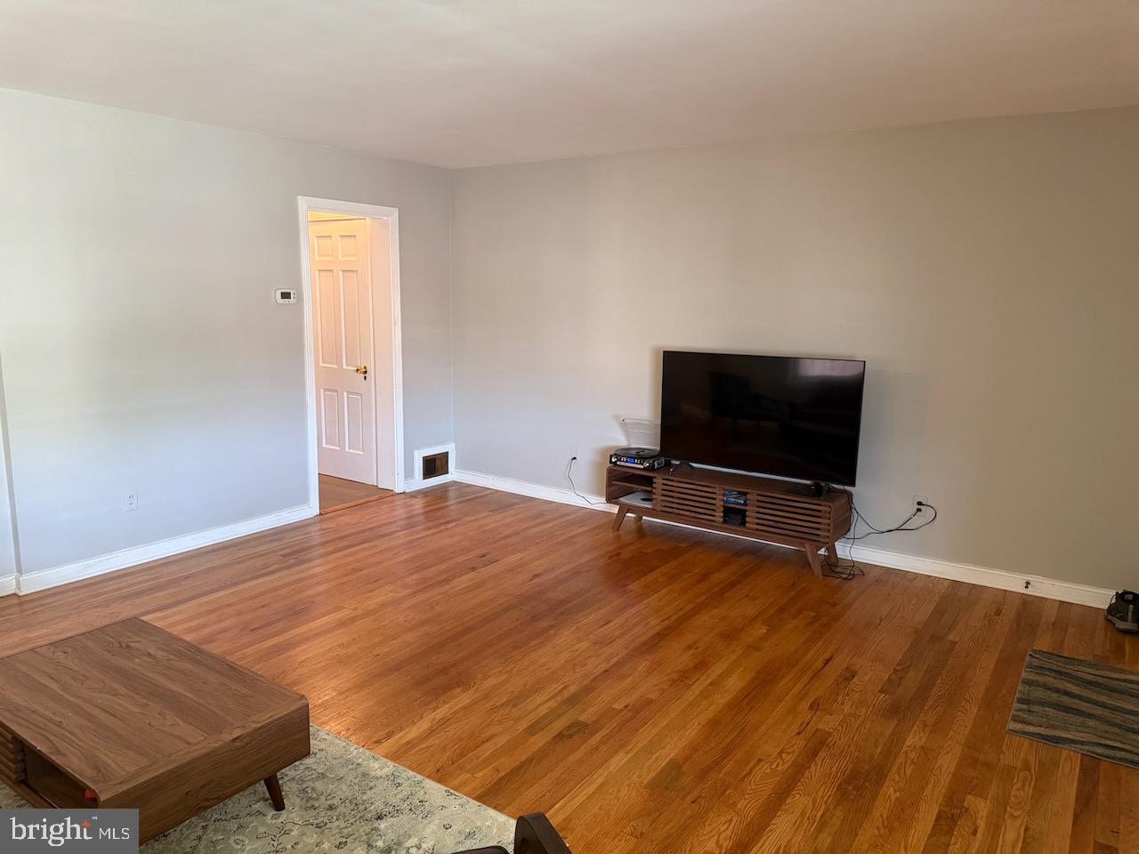 5032 Sargent Road Northeast Washington, DC 20017 - Photo 10 of 40 a living room with a flat screen tv and a couch