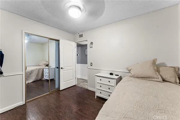 a bedroom with a bed and a view of bedroom