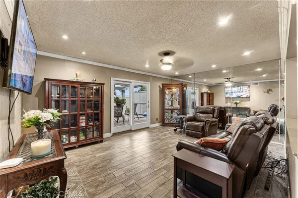 a living room with furniture a couch and a bookshelf