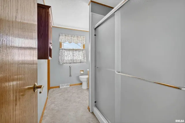 a view of bathroom with a window and tub