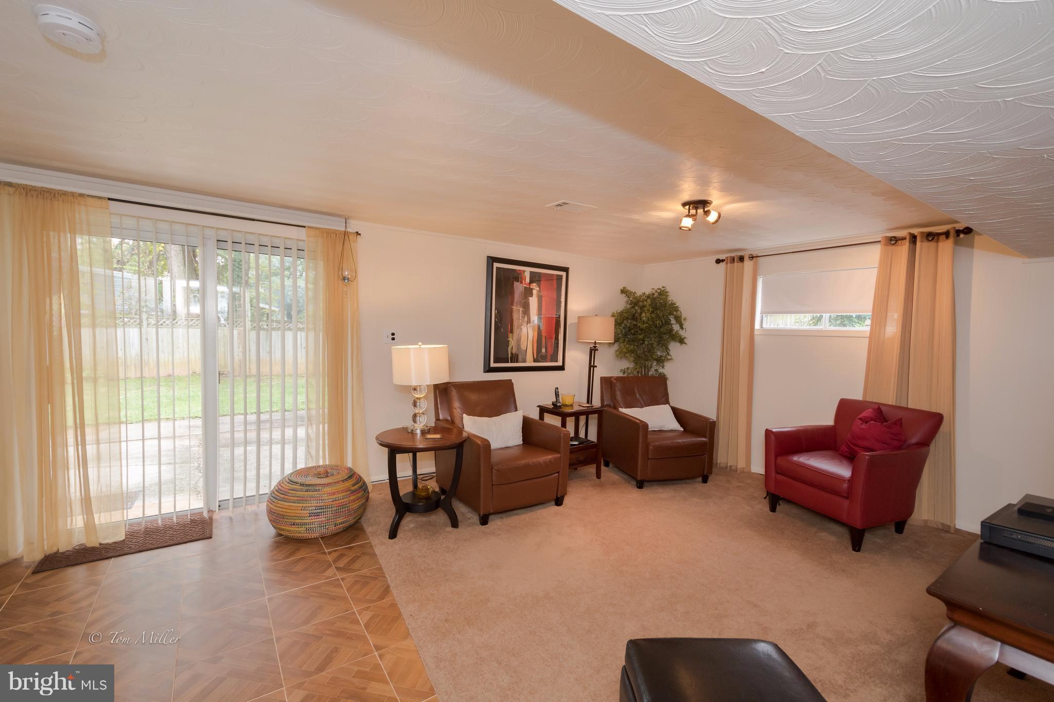 4603 Tema Road Baltimore, MD 21208 - Photo 22 of 28 a living room with furniture and a large window