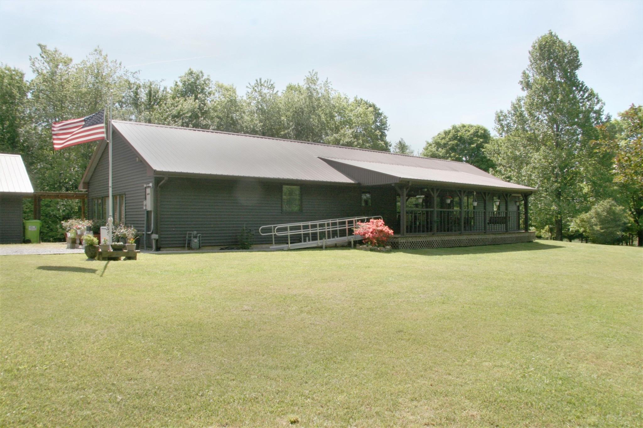 2176 Wilson Road Crossville, TN 38571 - Photo 1 of 34 a front view of a house with a yard and garage