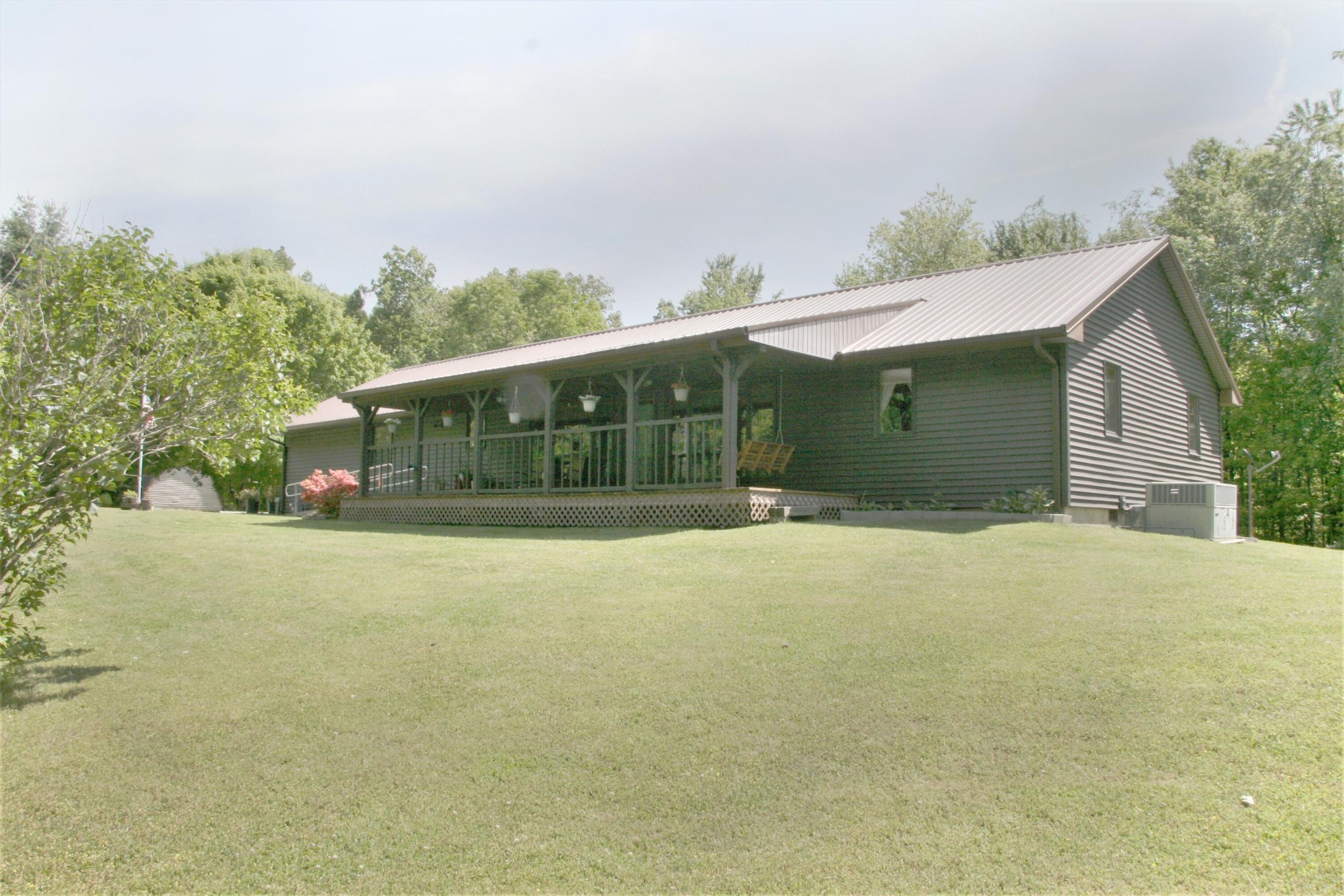 2176 Wilson Road Crossville, TN 38571 - Photo 3 of 34 a front view of a house with a garden
