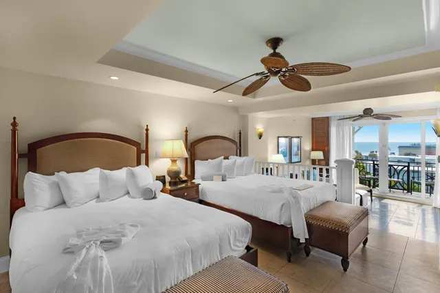 a bedroom with bed and a chandelier