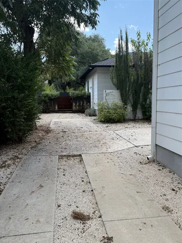 a view of backyard with potted plants