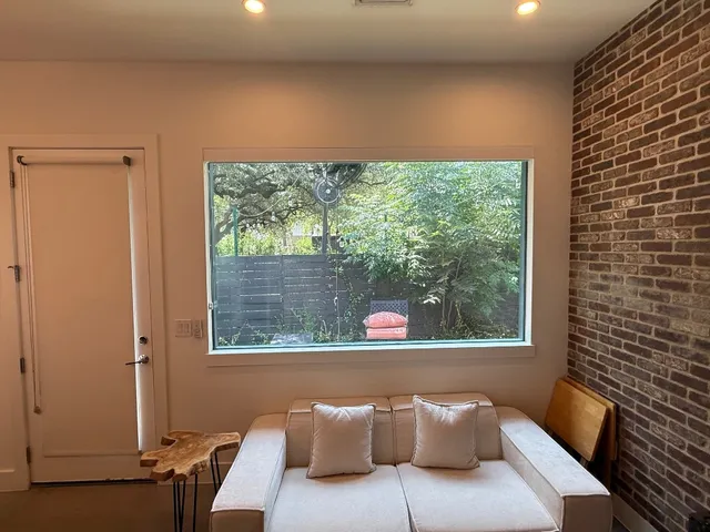 a balcony with furniture and a window