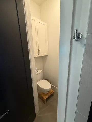 a bathroom with a toilet and a sink