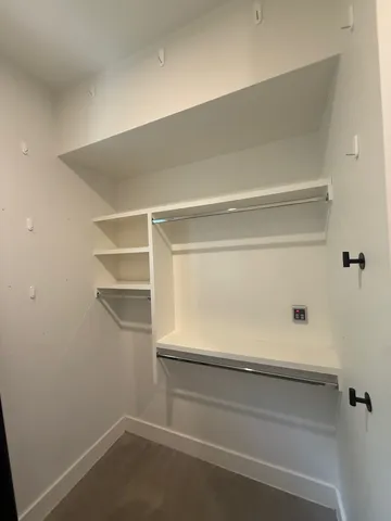 a view of an empty walk in closet