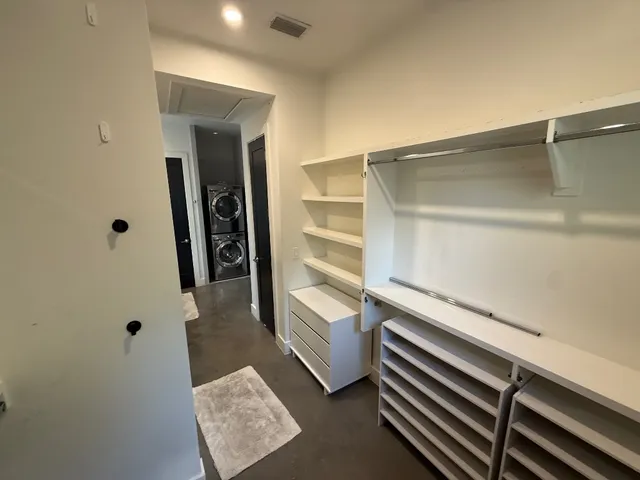 a view of an empty walk in closet