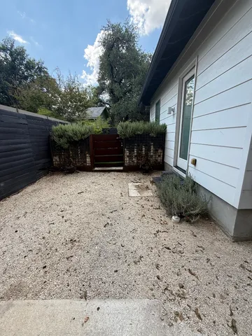 a view of a backyard of the house
