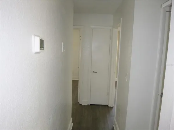a view of hallway with closet