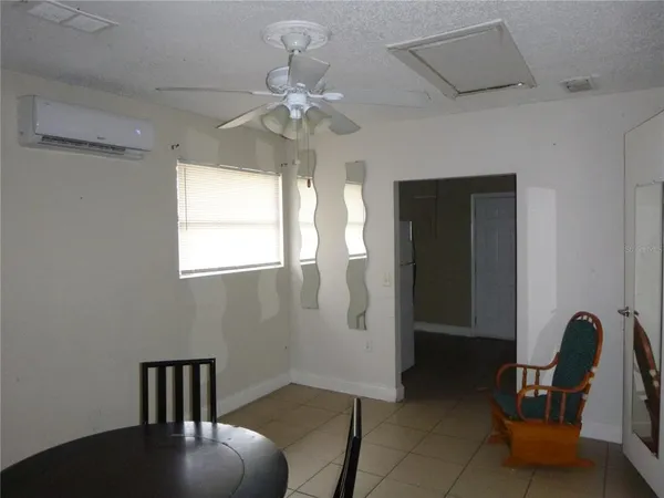 a view of livingroom with furniture and window