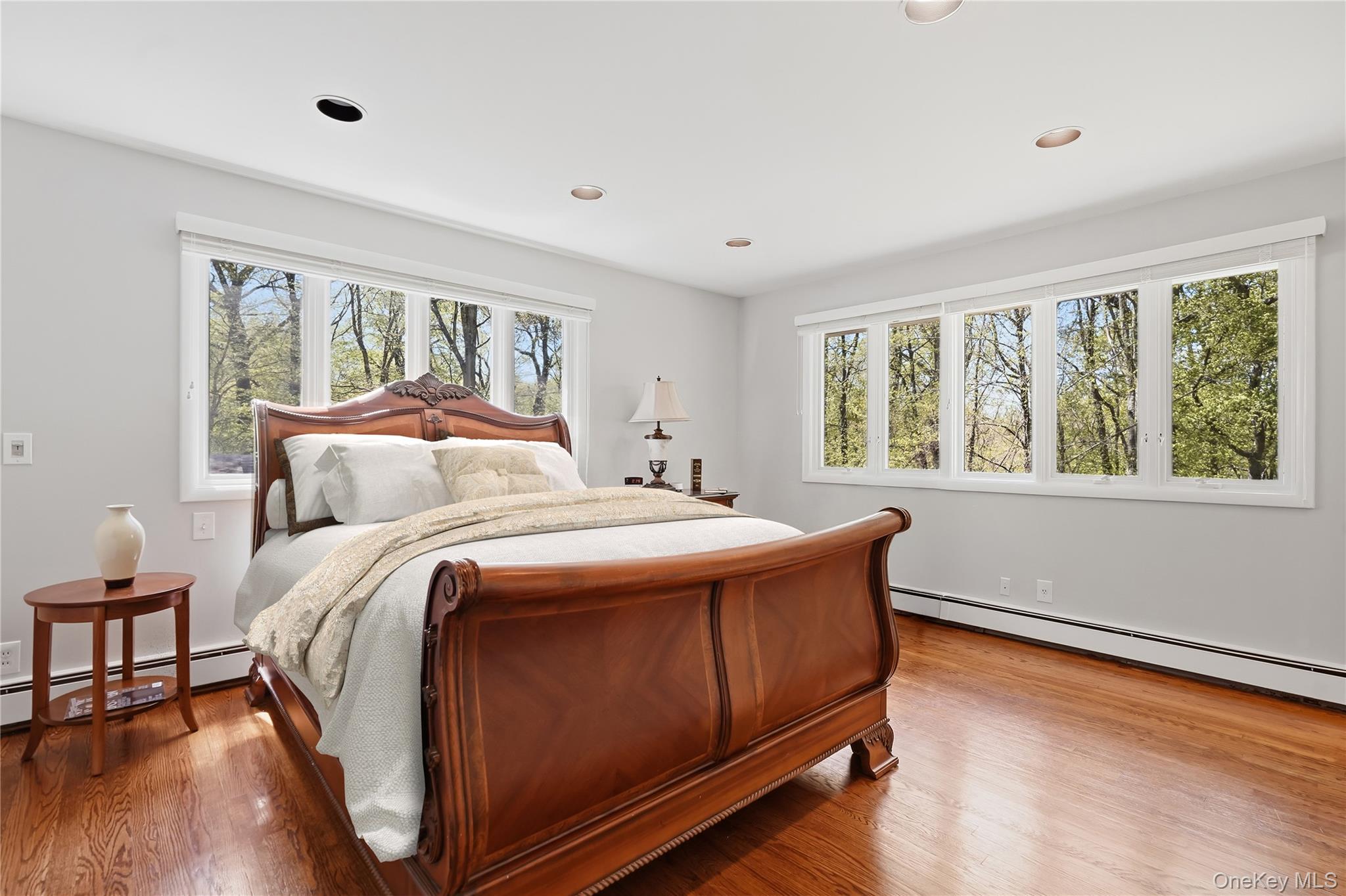 19 Macaulay Road Katonah, NY 10536 - Photo 11 of 19 Pimary bedroom with oversized windows and hardwood flooring