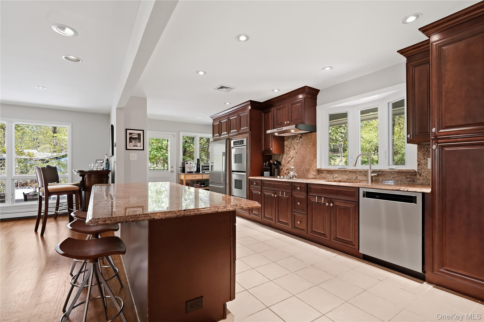 19 Macaulay Road Katonah, NY 10536 - Photo 7 of 19 Renovated kitchen with breakfast bar seating and granite countertops