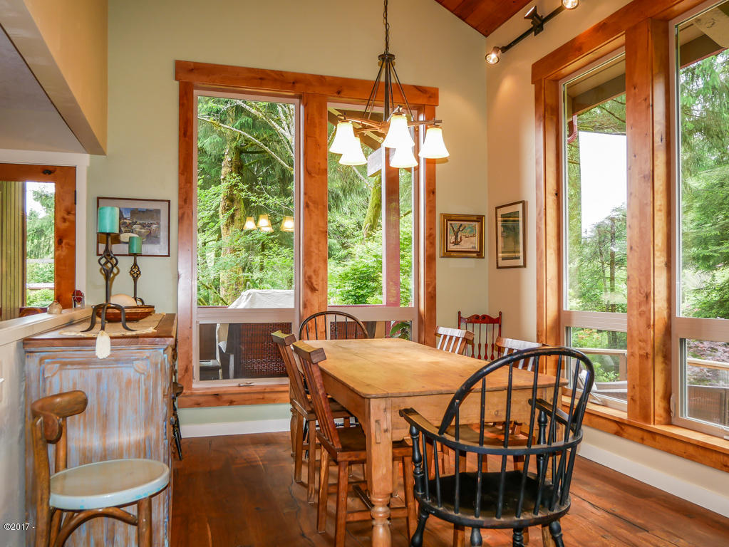 847 Hamer Road Siletz, OR 97380 - Photo 16 of 79 Dining room looking onto decks & creek
