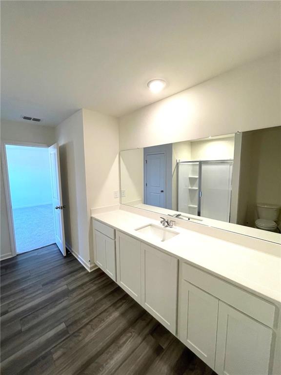 24 Rowlett Place Winder, GA 30680 - Photo 8 of 17 a bathroom with a double vanity sink and mirror