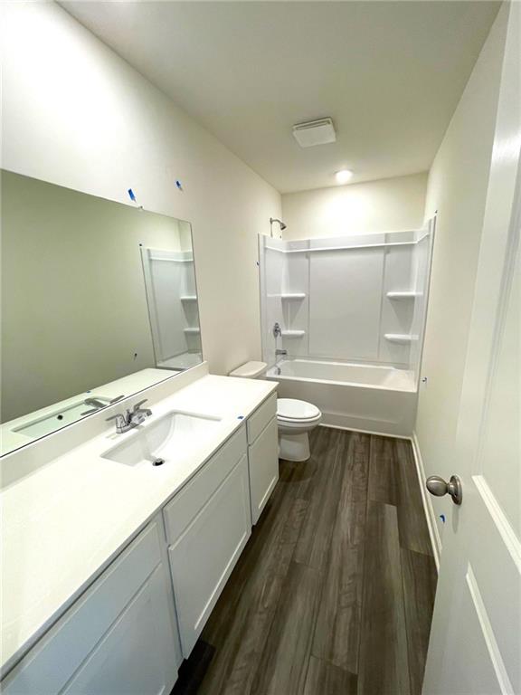 24 Rowlett Place Winder, GA 30680 - Photo 10 of 17 a spacious bathroom with a tub sink shower and a mirror