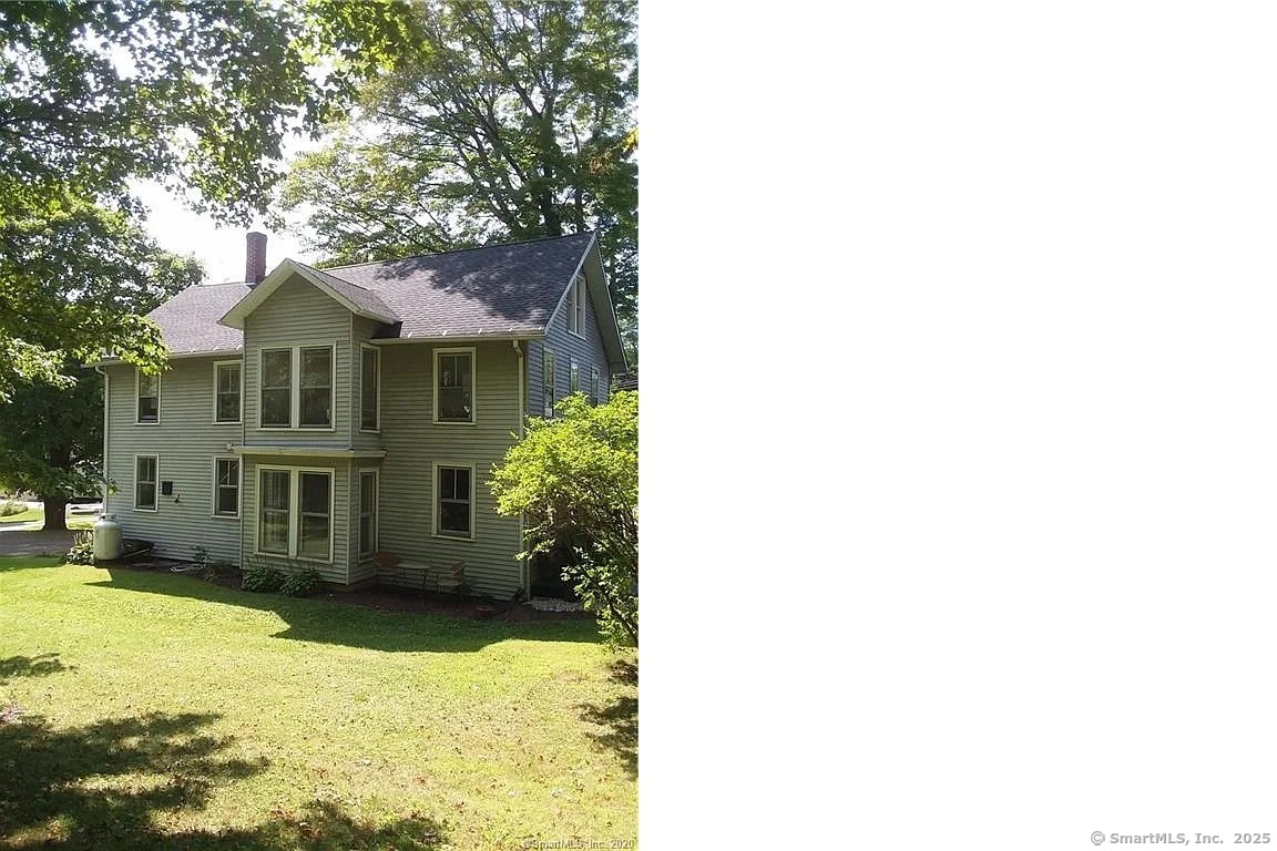 a house view with swimming pool