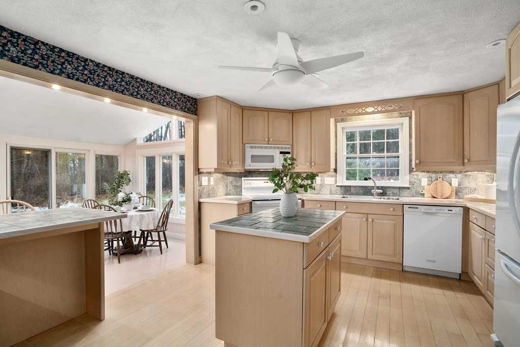62 Rambling Road Sudbury, MA 01776 - Photo 14 of 38 a kitchen with counter top space appliances and windows