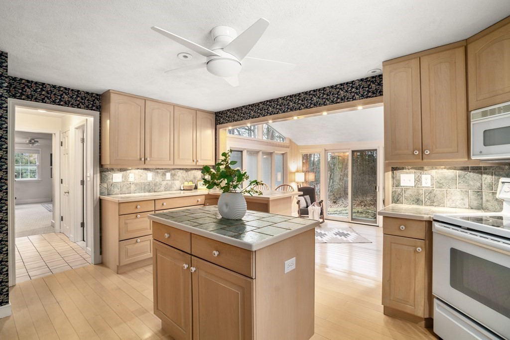 62 Rambling Road Sudbury, MA 01776 - Photo 16 of 38 a kitchen with a refrigerator and a sink