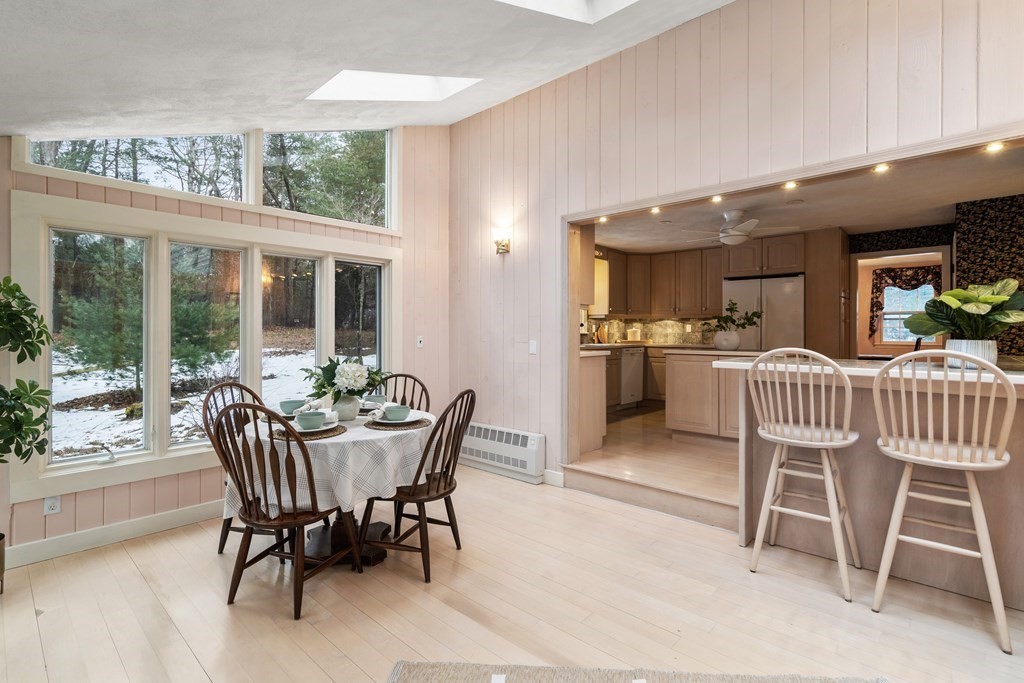 62 Rambling Road Sudbury, MA 01776 - Photo 18 of 38 a dining room with a wooden table and chairs