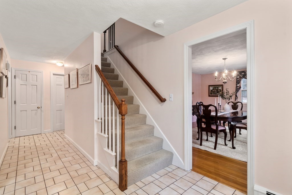 62 Rambling Road Sudbury, MA 01776 - Photo 19 of 38 a view of a hallway with wooden floor and entryway